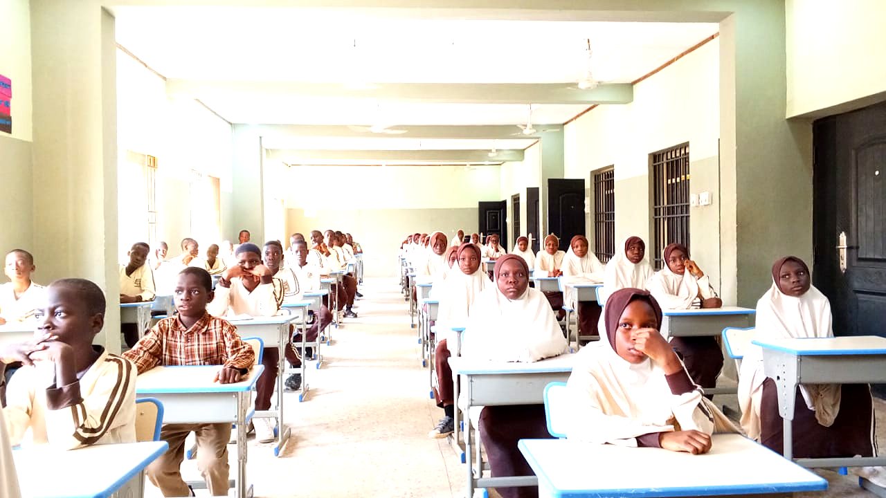 A Sultan Hanafi classroom in session, pupils at their desks in school uniform