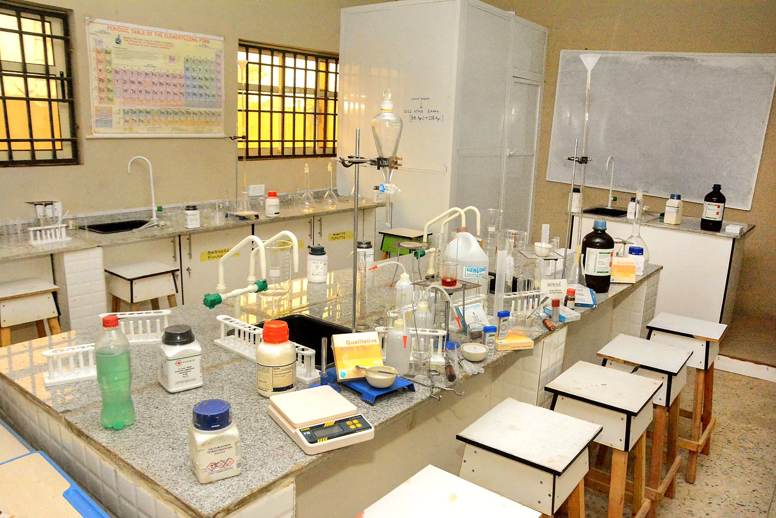 The Chemistry Laboratory at Royal College, benches laid out with reagents and apparatus