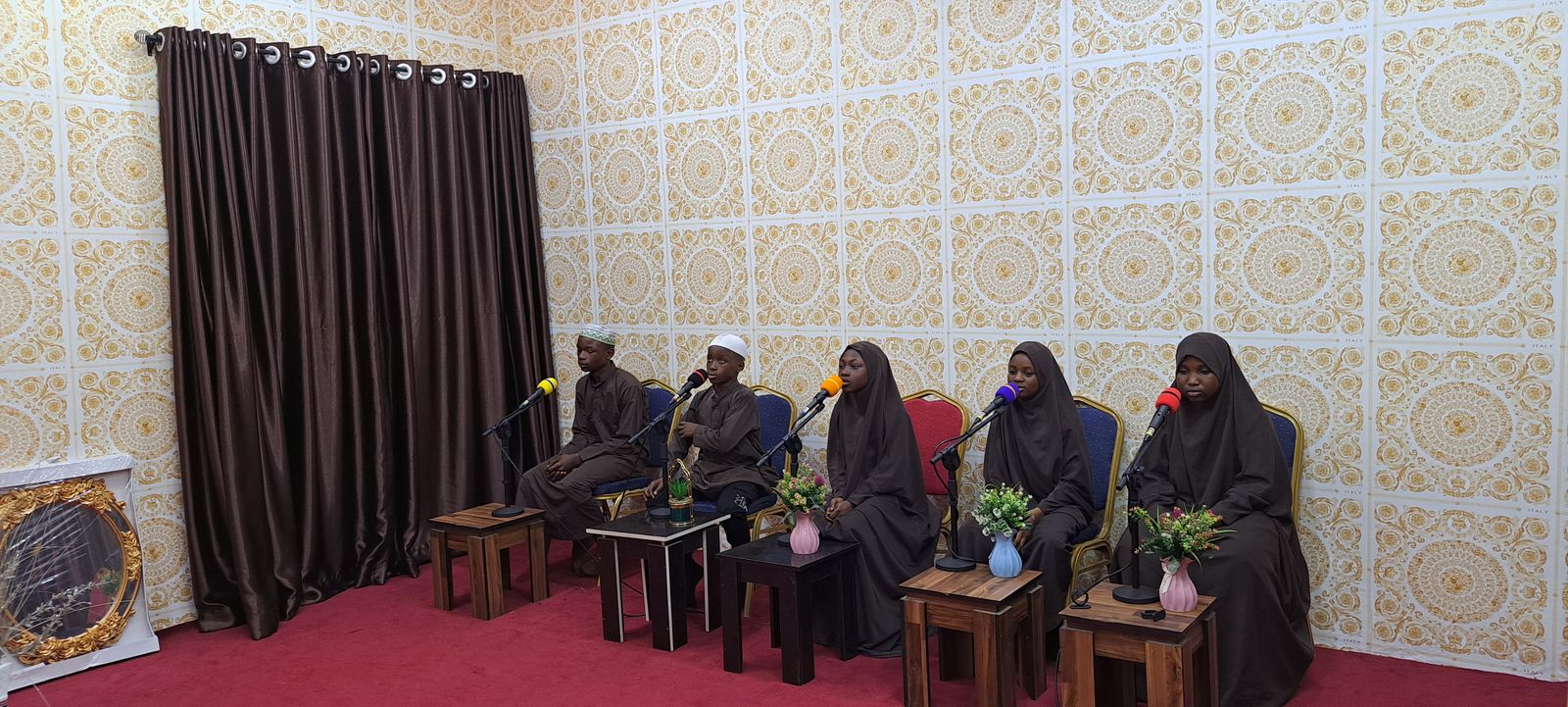 A second view of Qur'an College students presenting a Qur'an recitation on stage